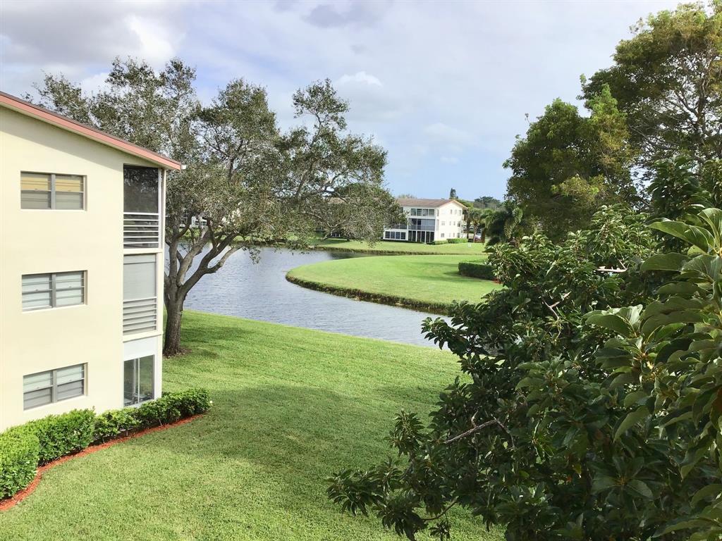 204 Preston Way, Unit 204 Boca Raton, FL 33434 - Photo 29 of 31 a view of a house with a yard