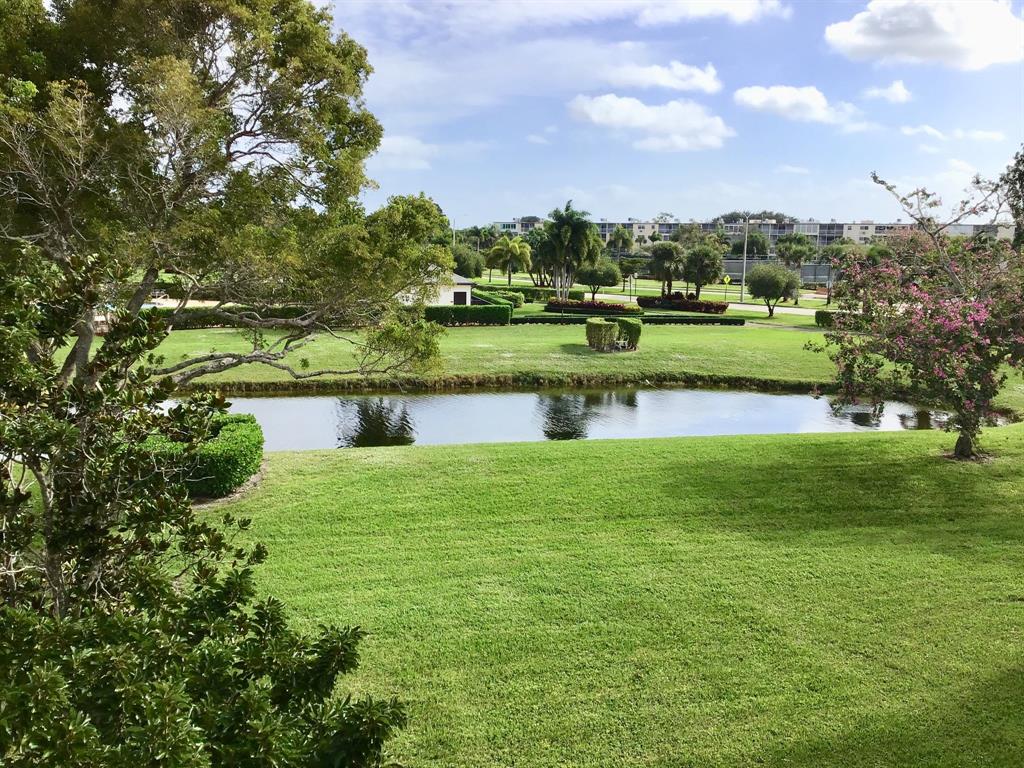 204 Preston Way, Unit 204 Boca Raton, FL 33434 - Photo 31 of 31 an aerial view of a house with a yard lake and outdoor seating
