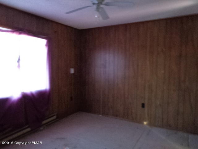 6207 Decker Road Bushkill, PA 18324 - Photo 5 of 6 an empty room with a window