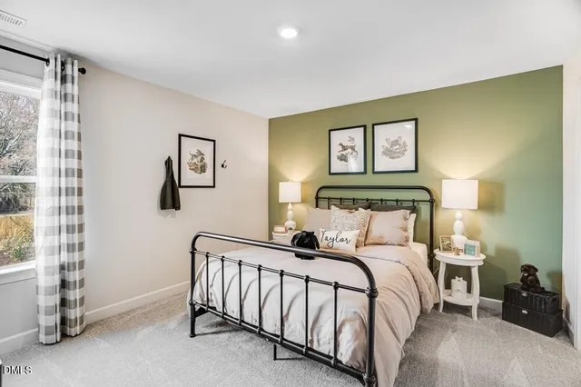 an aerial view of a wooden table and chairs