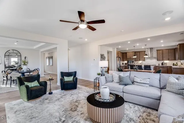 a living room with fireplace furniture and a flat screen tv