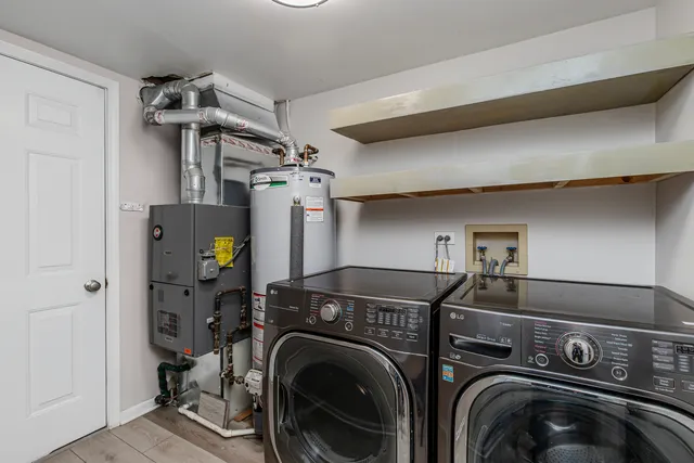 a view of a storage & utility room with washer and dryer