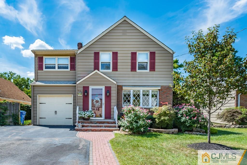 193 New Dover Road Colonia, NJ 07067 - Photo 1 of 25 a front view of a house with garden