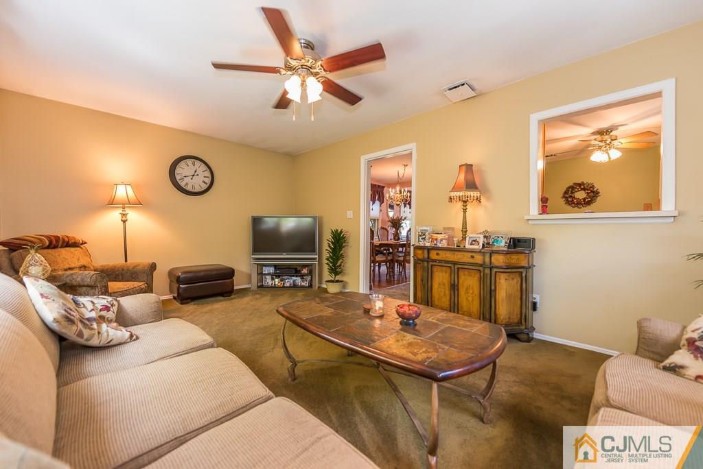 193 New Dover Road Colonia, NJ 07067 - Photo 11 of 25 a living room with furniture and a flat screen tv