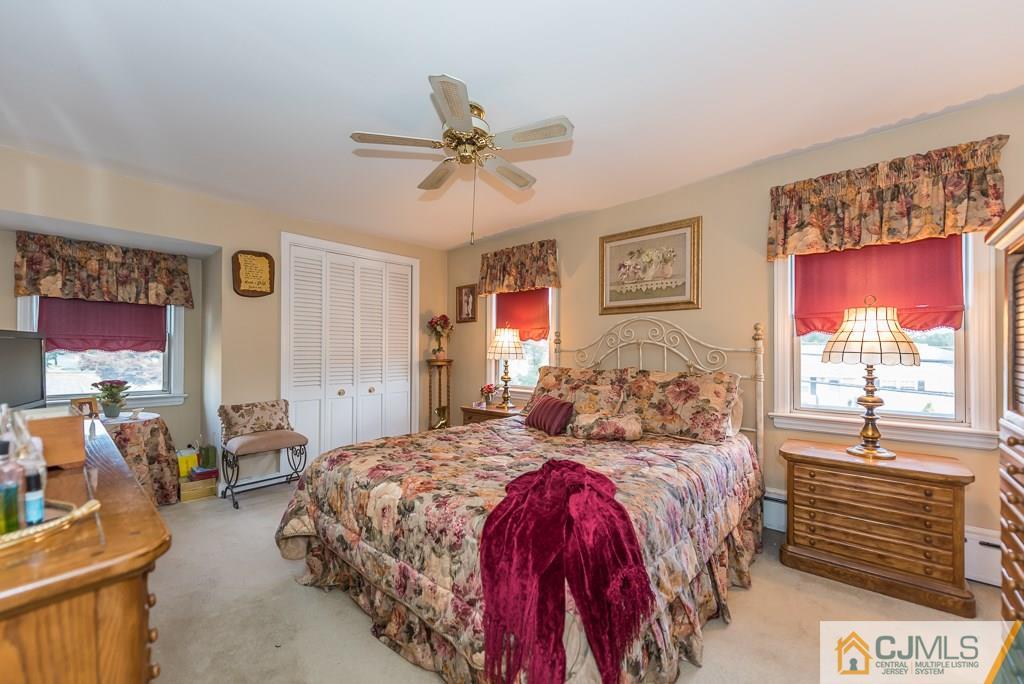 193 New Dover Road Colonia, NJ 07067 - Photo 15 of 25 a bedroom with a bed and a flat screen tv