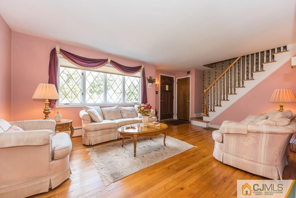 193 New Dover Road Colonia, NJ 07067 - Photo 4 of 25 a living room with furniture and a large window