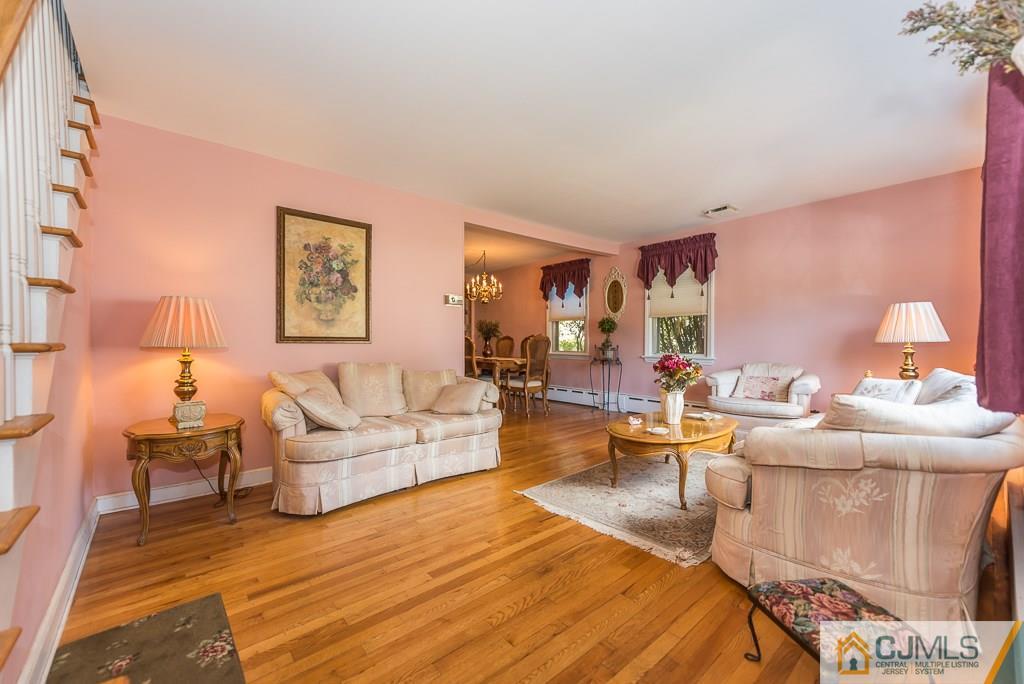 193 New Dover Road Colonia, NJ 07067 - Photo 5 of 25 a living room with furniture and a lamp