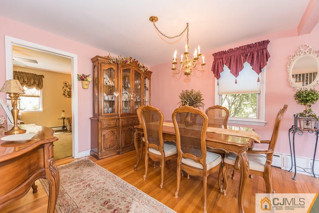 193 New Dover Road Colonia, NJ 07067 - Photo 8 of 25 a view of a dining room with furniture and wooden floor