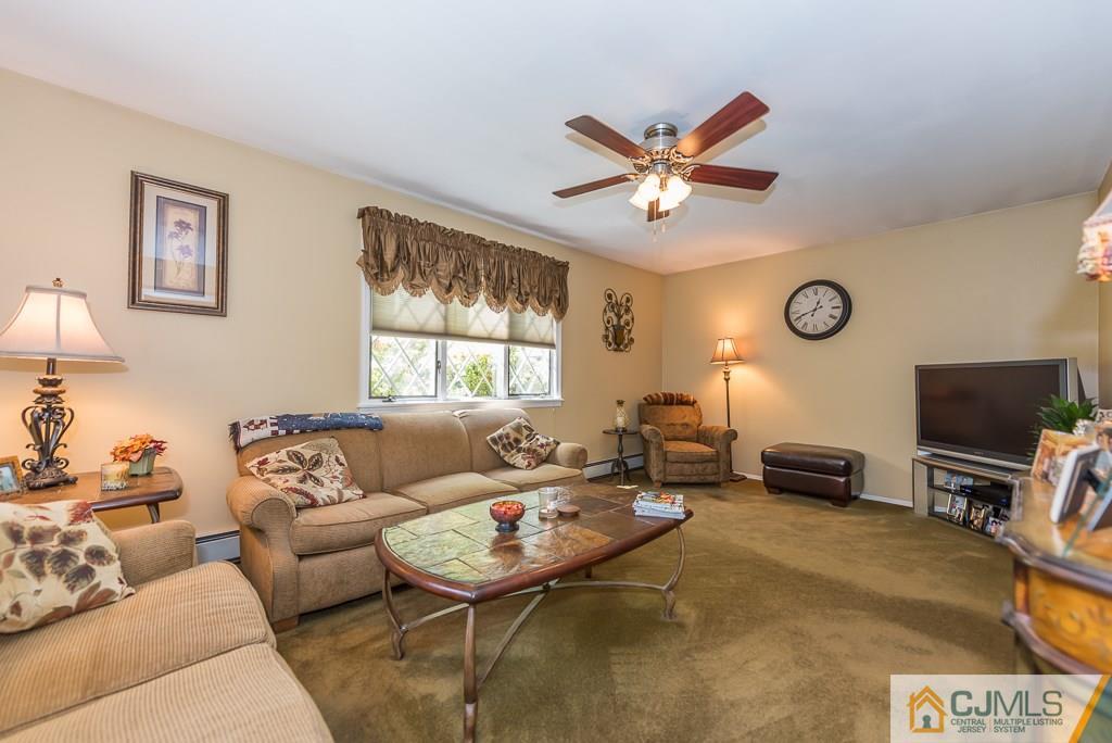 193 New Dover Road Colonia, NJ 07067 - Photo 10 of 25 a living room with furniture and a flat screen tv