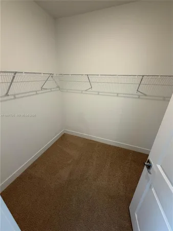 a view of a room with racks on the wall