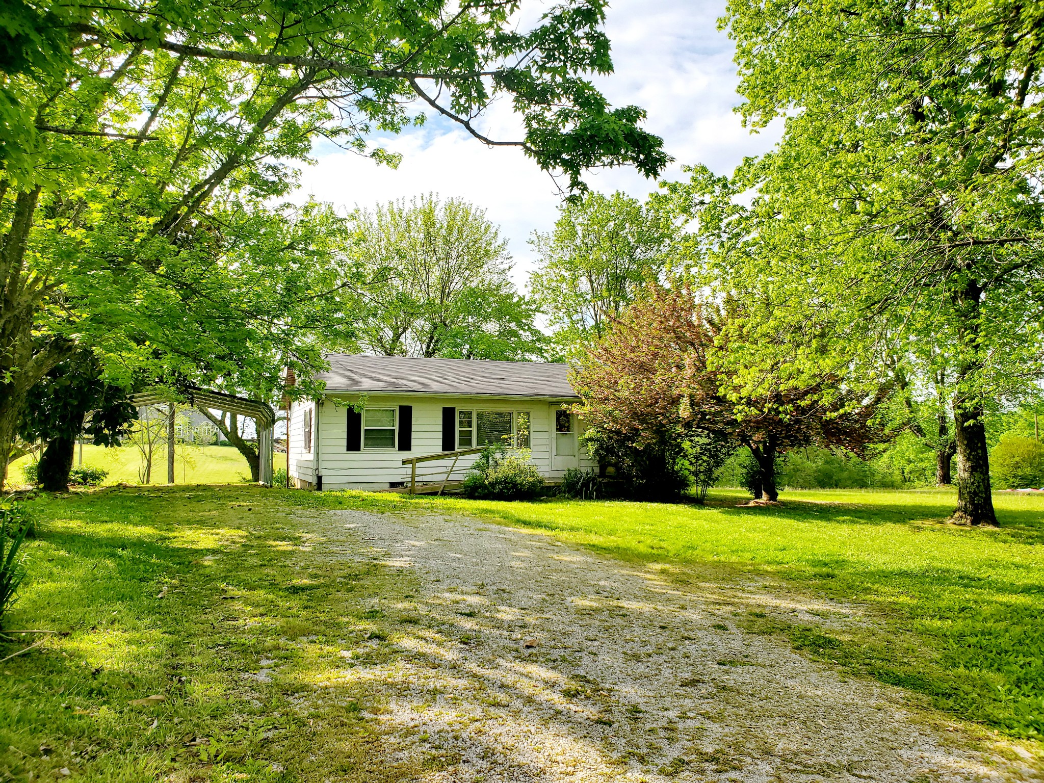 a view of an house with a garden