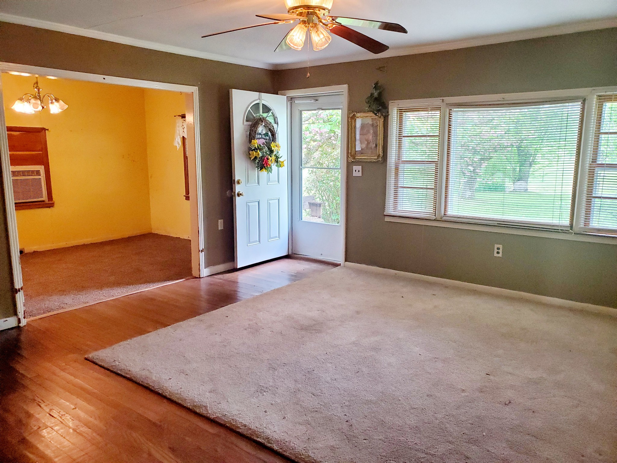 8340 Austin Bottom Road Baxter, TN 38544 - Photo 12 of 32 an empty room with wooden floor and windows