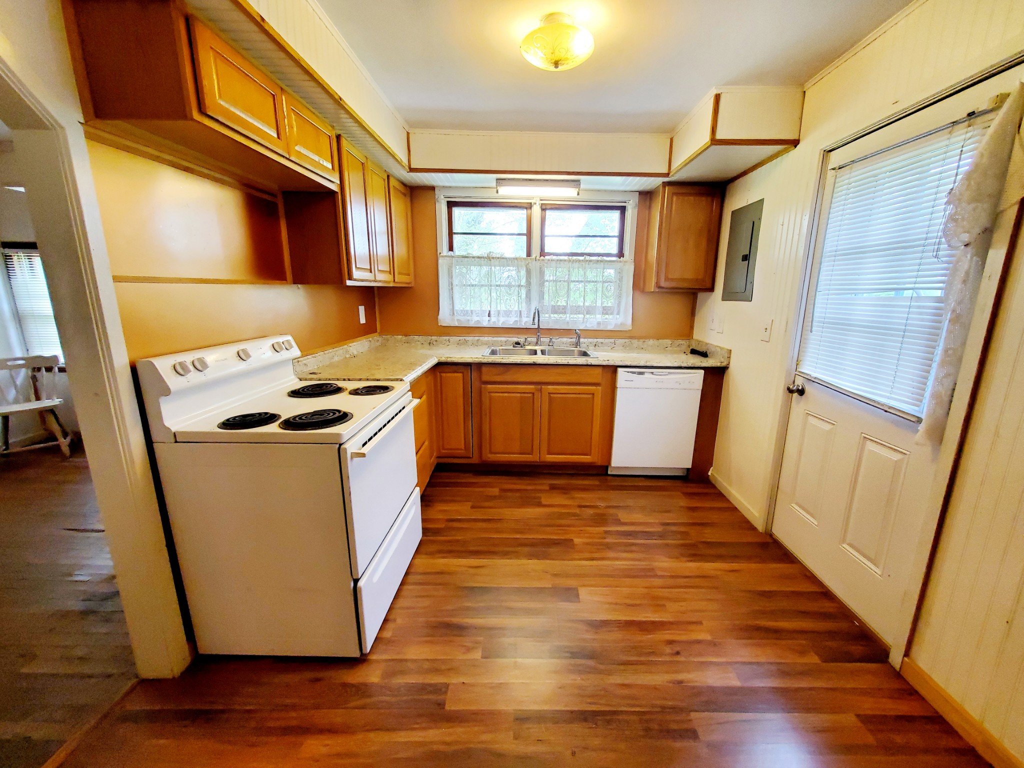8340 Austin Bottom Road Baxter, TN 38544 - Photo 15 of 32 a kitchen with sink a refrigerator and wooden floor