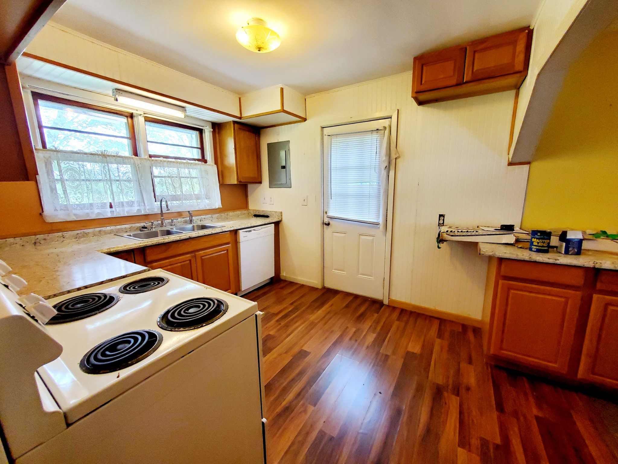 8340 Austin Bottom Road Baxter, TN 38544 - Photo 16 of 32 a kitchen with wooden floors and a stove