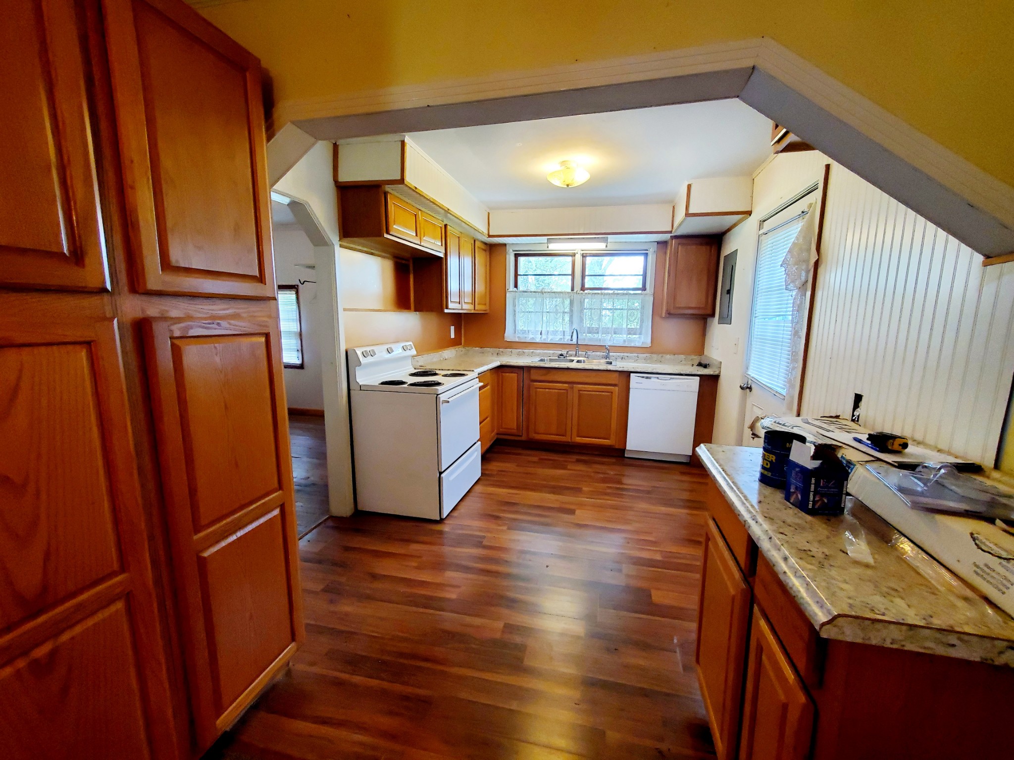 8340 Austin Bottom Road Baxter, TN 38544 - Photo 20 of 32 a kitchen with stainless steel appliances granite countertop a sink stove and refrigerator