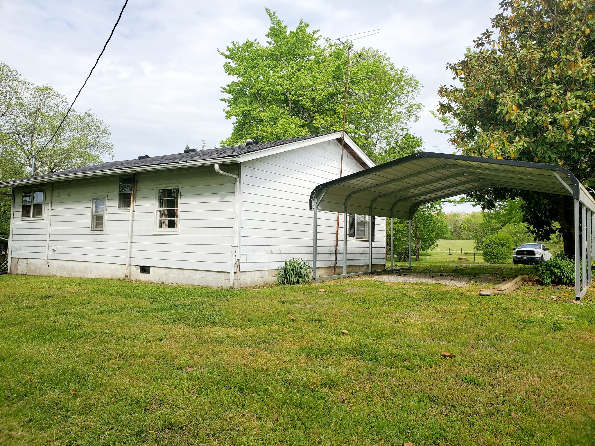 8340 Austin Bottom Road Baxter, TN 38544 - Photo 4 of 32 a backyard of a house with yard and outdoor seating