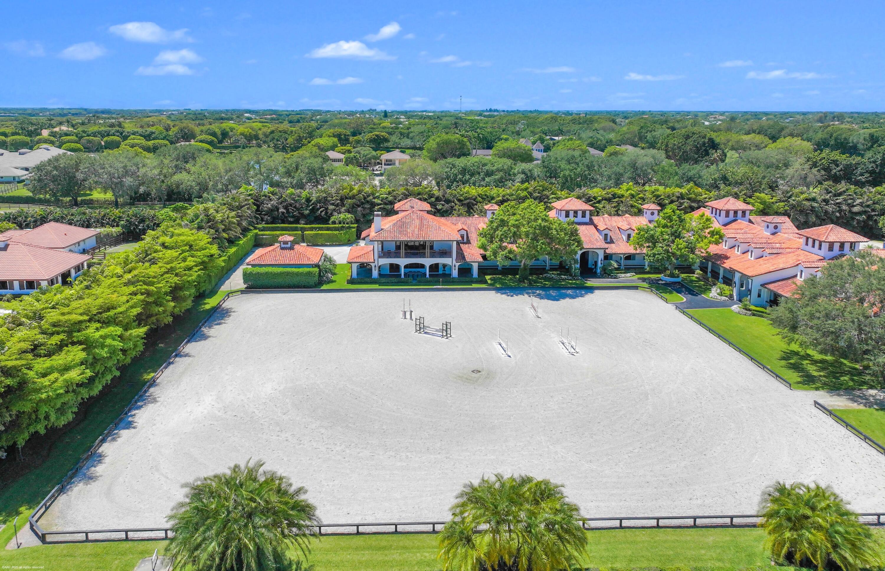 14775 Equestrian Way, Unit STALLS Wellington, FL 33414 - Photo 9 of 19 an aerial view of a house with a garden