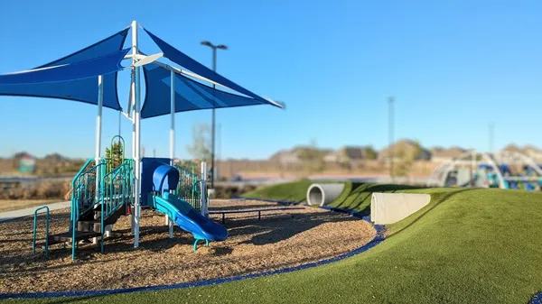 a view of park with a slide
