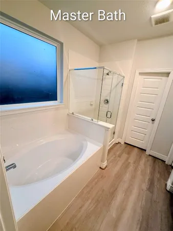 a bathroom with a double vanity sink and mirror