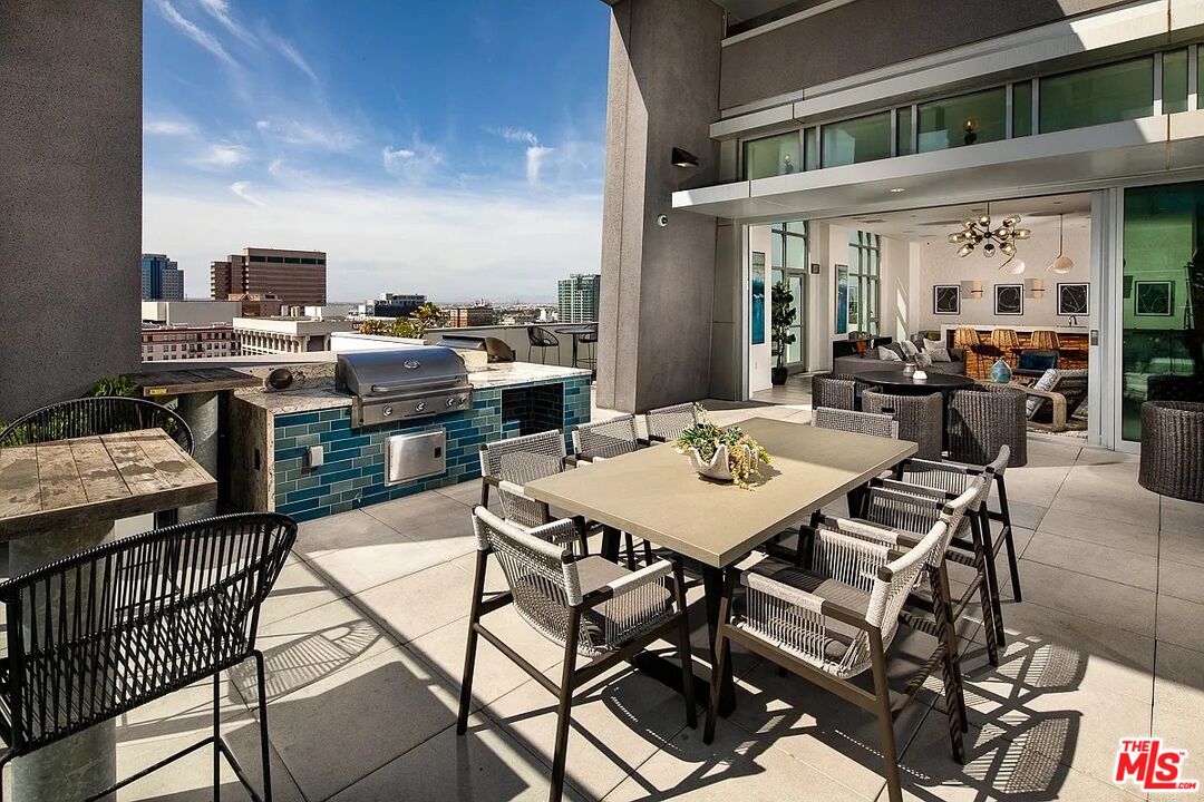 707 East Ocean Boulevard, Unit 712 Long Beach, CA 90802 - Photo 6 of 20 a view of a patio with table and chairs