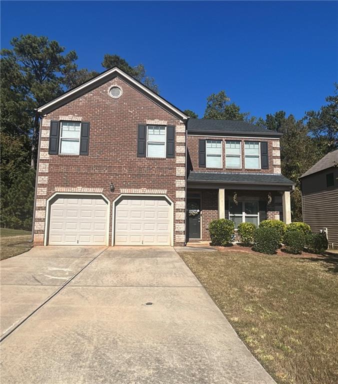 376 Pernell Drive Hampton, GA 30228 - Photo 1 of 1 a front view of a house with a yard