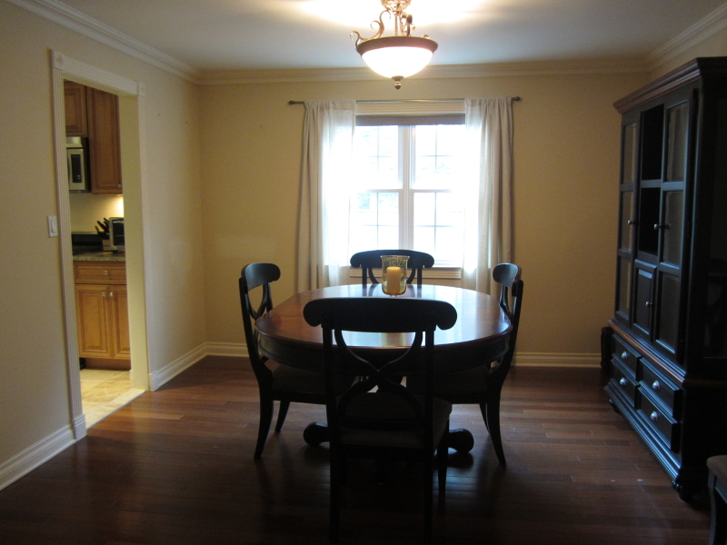 67 New England Avenue, Unit F Summit, NJ 07901 - Photo 3 of 14 a view of a dining room with furniture window and wooden floor