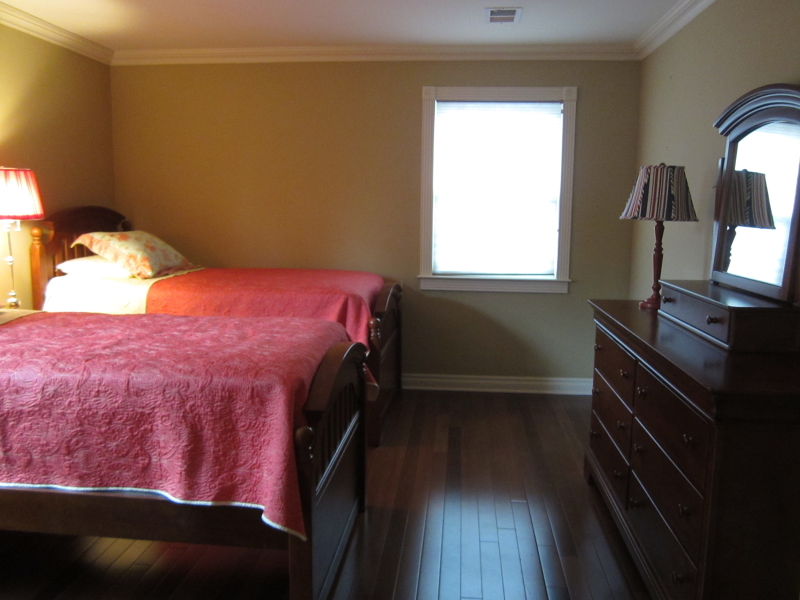 67 New England Avenue, Unit F Summit, NJ 07901 - Photo 7 of 14 a bedroom with a bed and a window