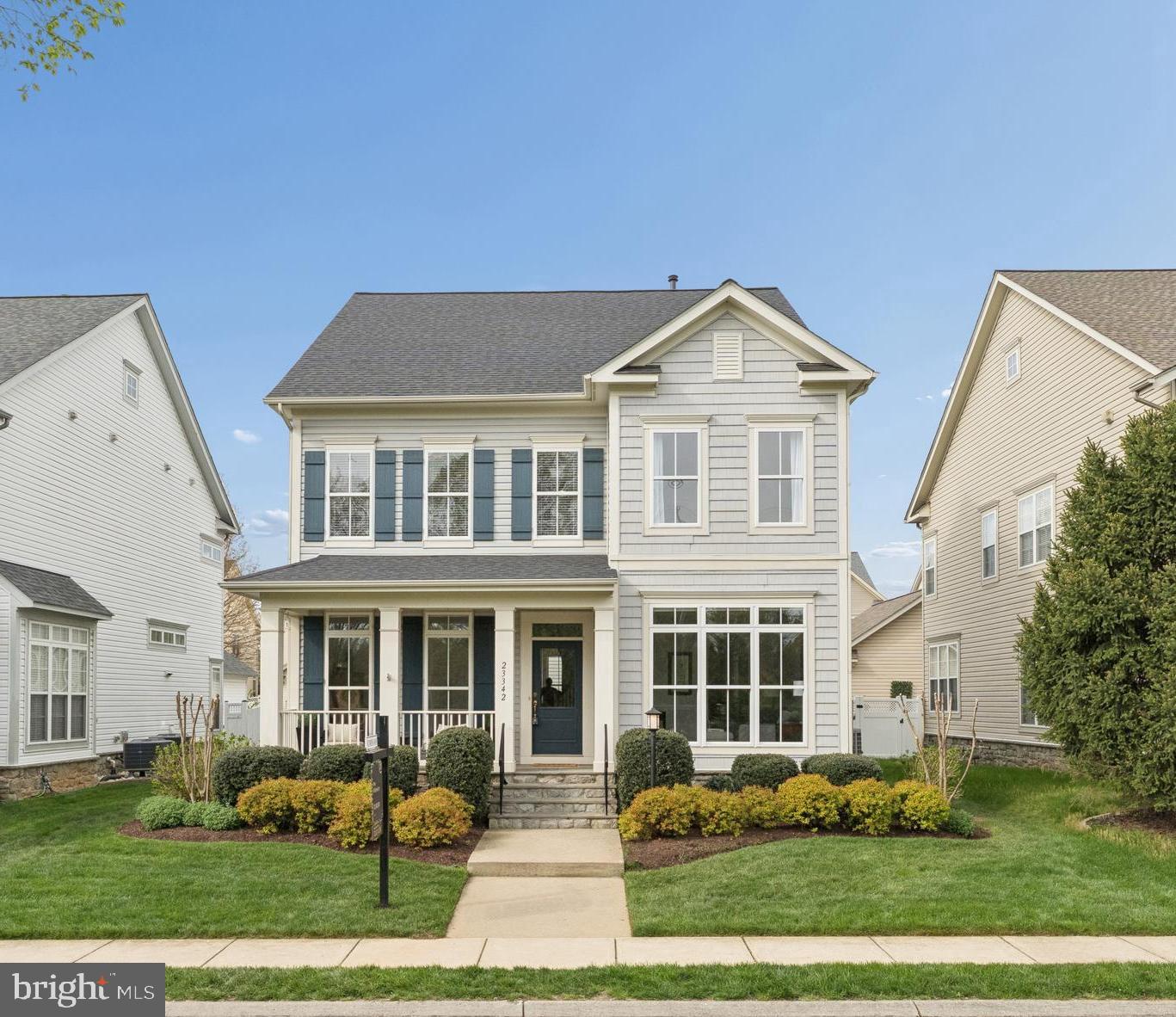 23342 Higbee Lane Brambleton, VA 20148 - Photo 1 of 73 a front view of a house with garden