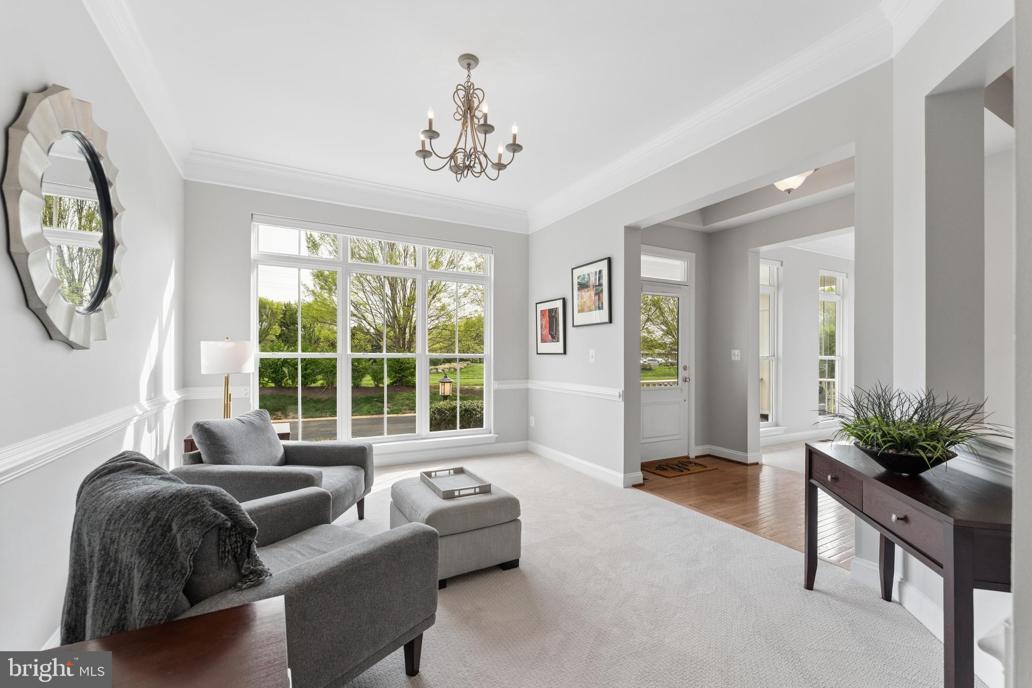 23342 Higbee Lane Brambleton, VA 20148 - Photo 12 of 73 a living room with furniture and a large window