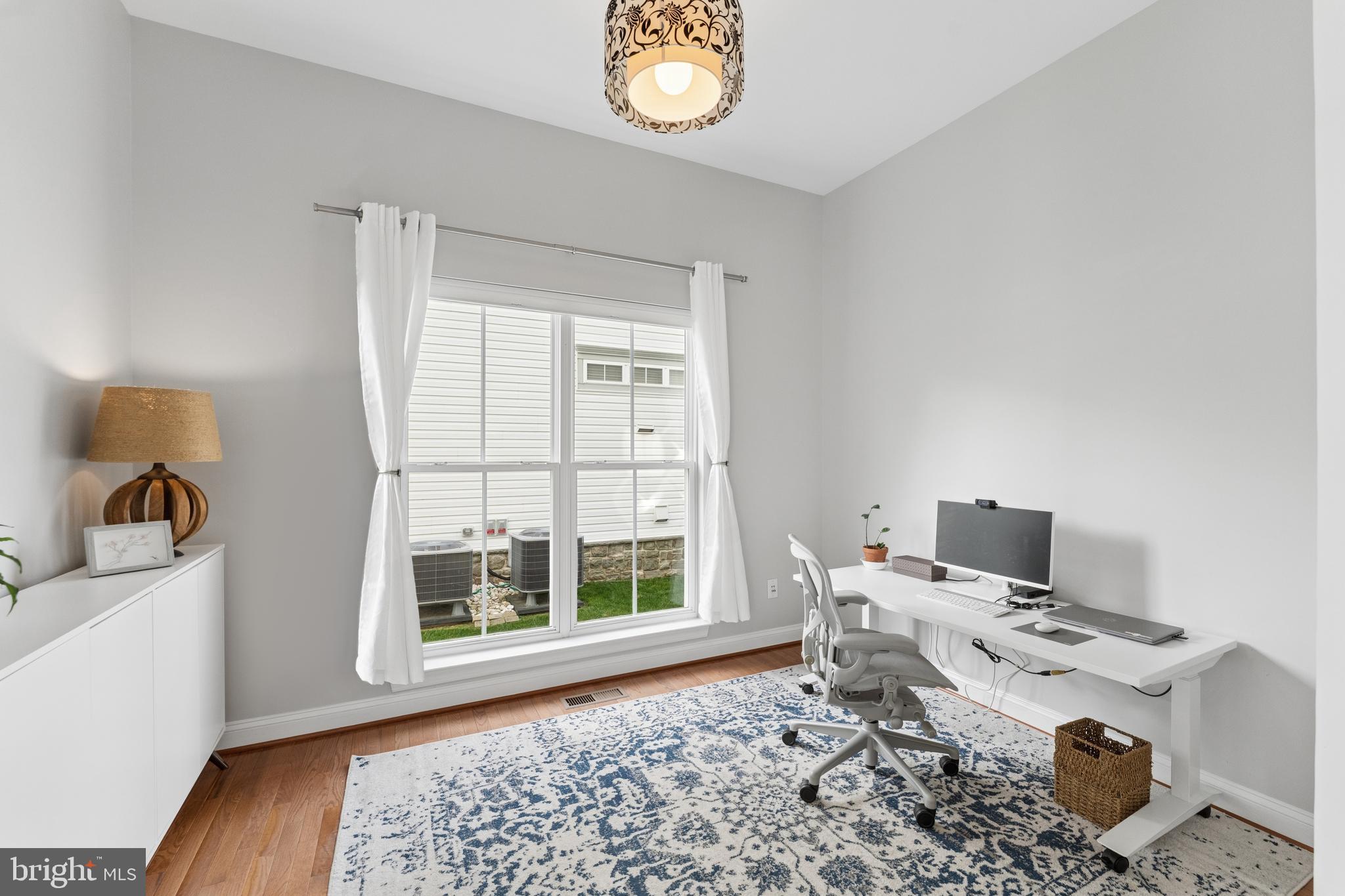 23342 Higbee Lane Brambleton, VA 20148 - Photo 16 of 73 a living room with a couch and a window