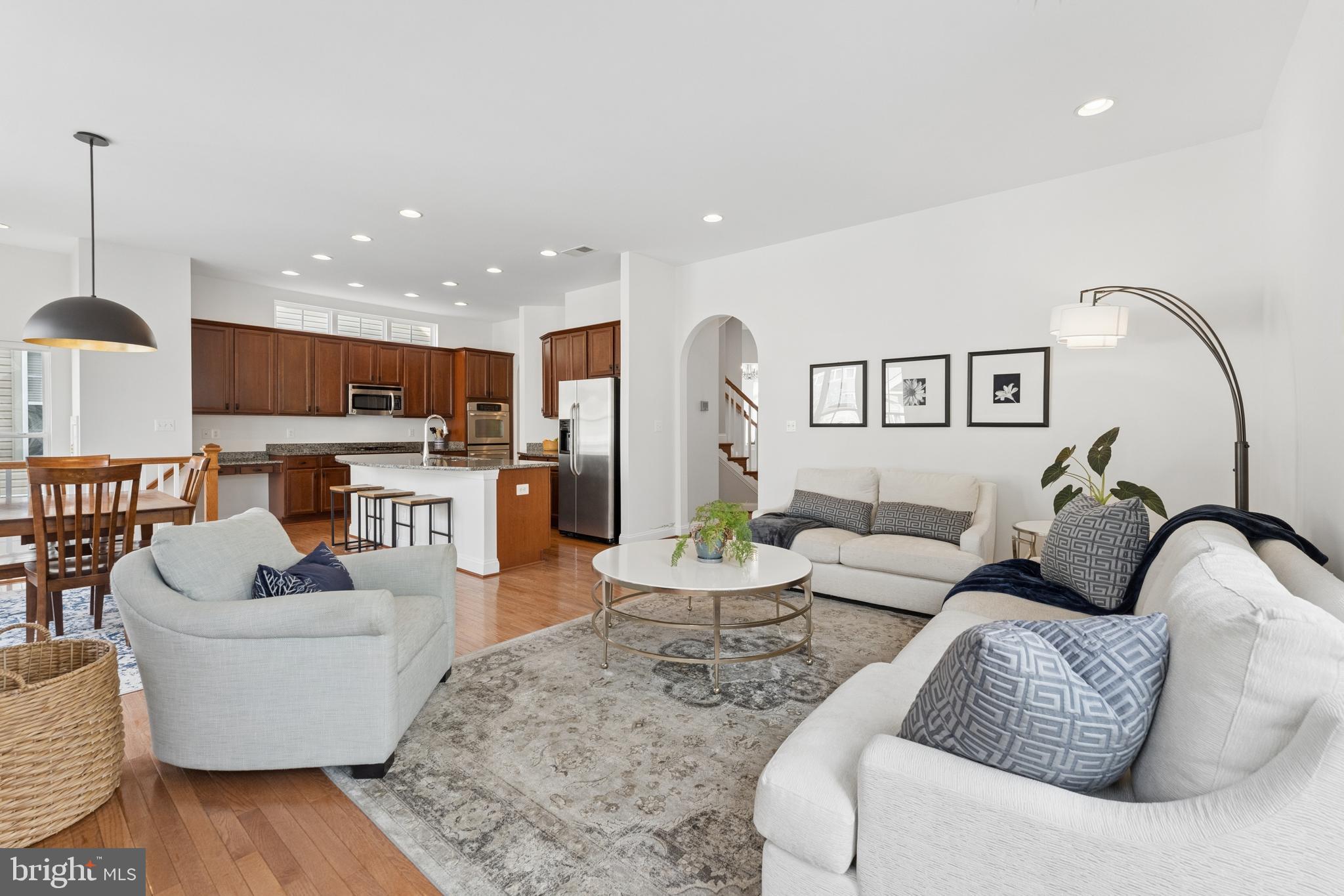 23342 Higbee Lane Brambleton, VA 20148 - Photo 71 of 73 a living room with furniture and kitchen view