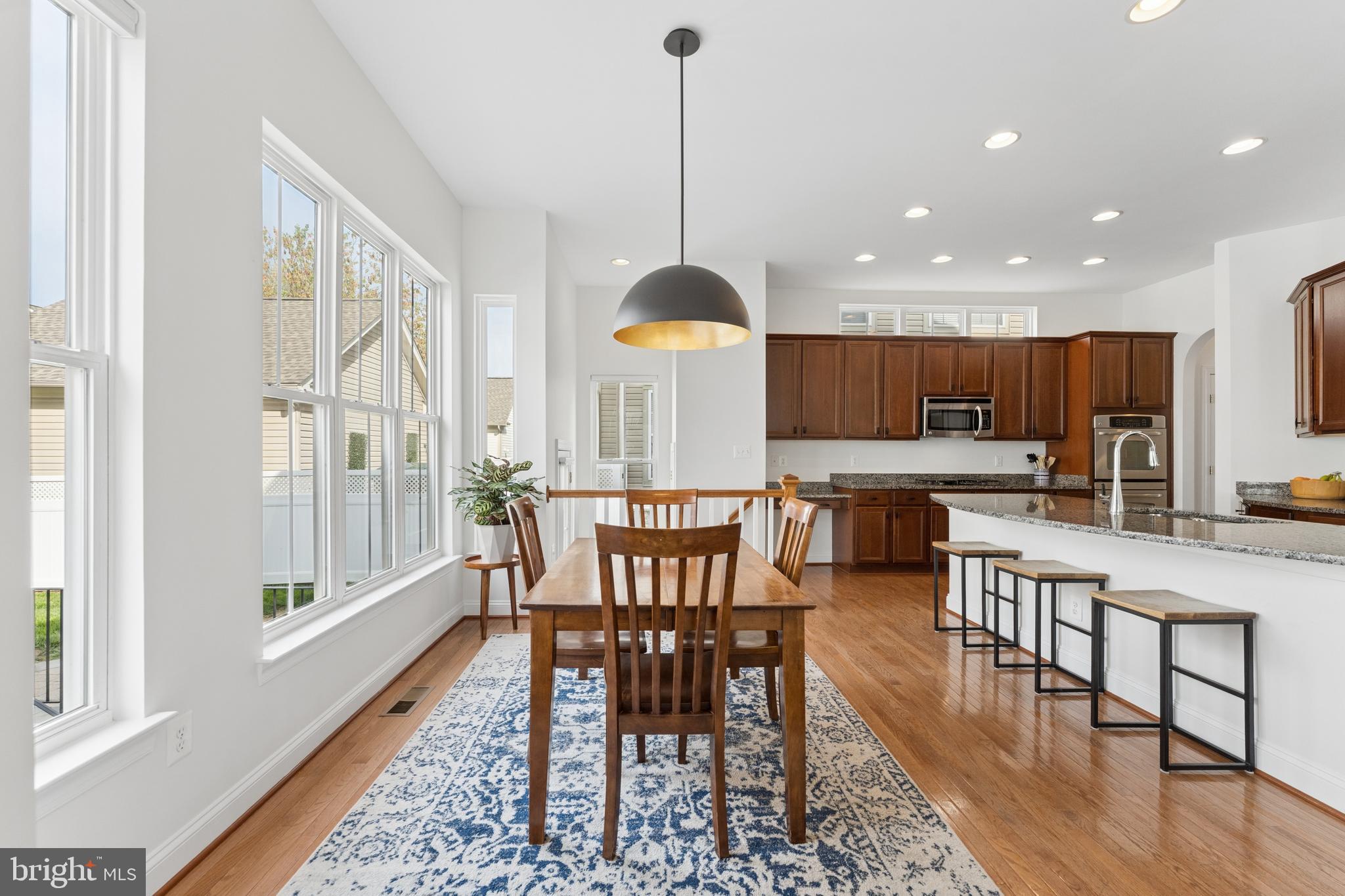 23342 Higbee Lane Brambleton, VA 20148 - Photo 28 of 73 a view of a dining room with furniture window and wooden floor
