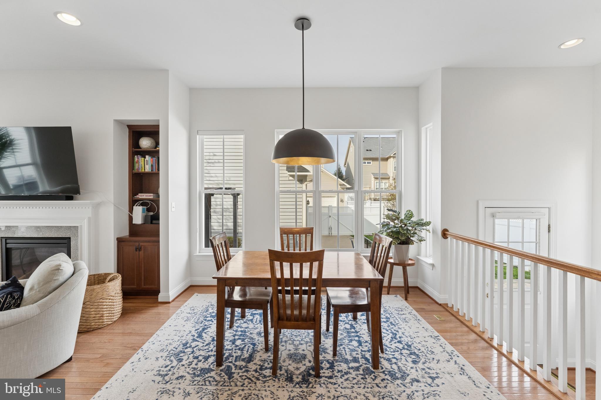 23342 Higbee Lane Brambleton, VA 20148 - Photo 29 of 73 a dining room with furniture a chandelier and window