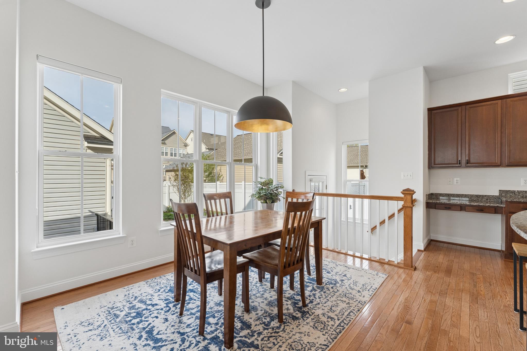 23342 Higbee Lane Brambleton, VA 20148 - Photo 30 of 73 a dining room with furniture window and wooden floor
