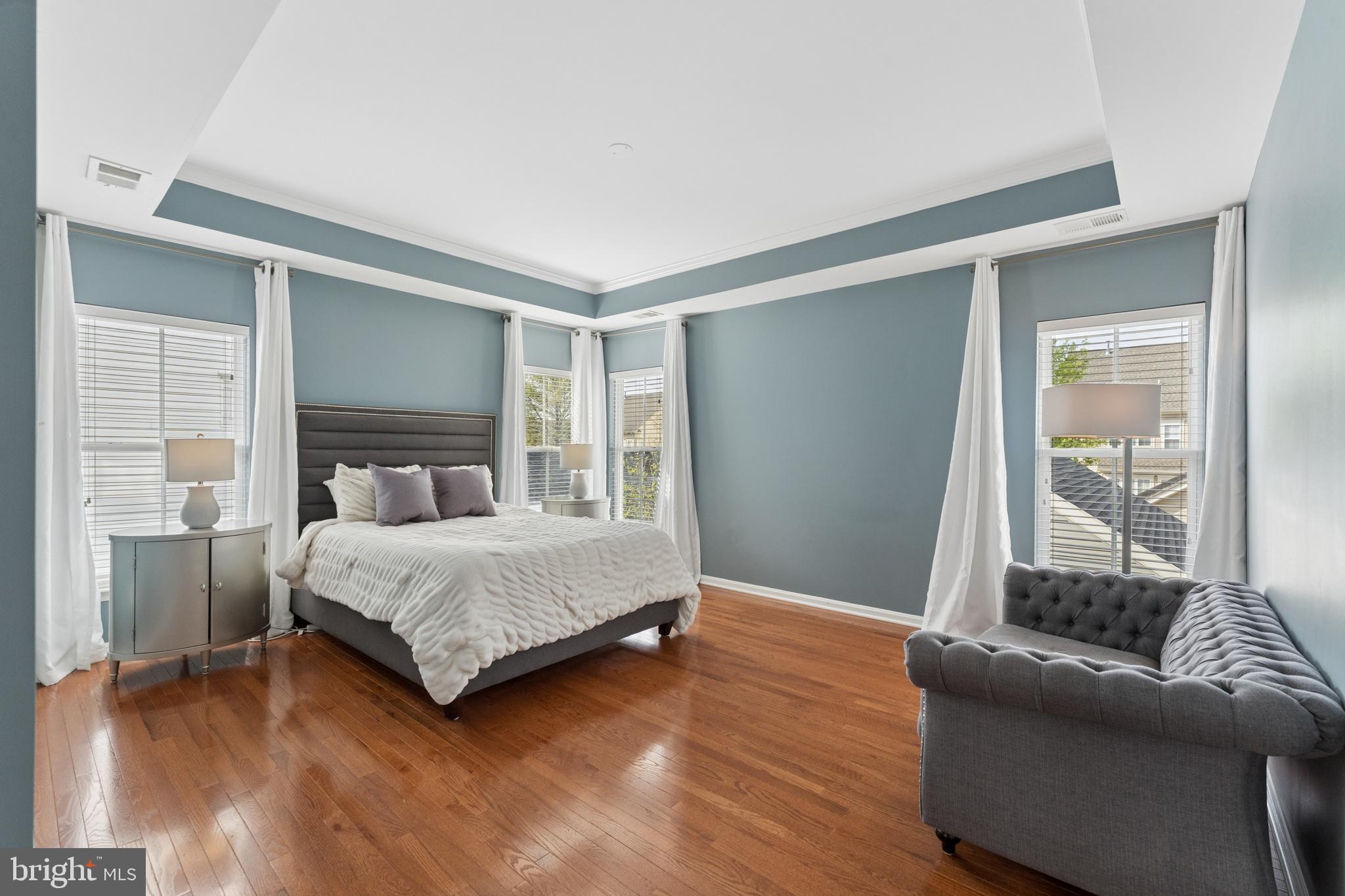 23342 Higbee Lane Brambleton, VA 20148 - Photo 34 of 73 a bedroom with a bed and glass door