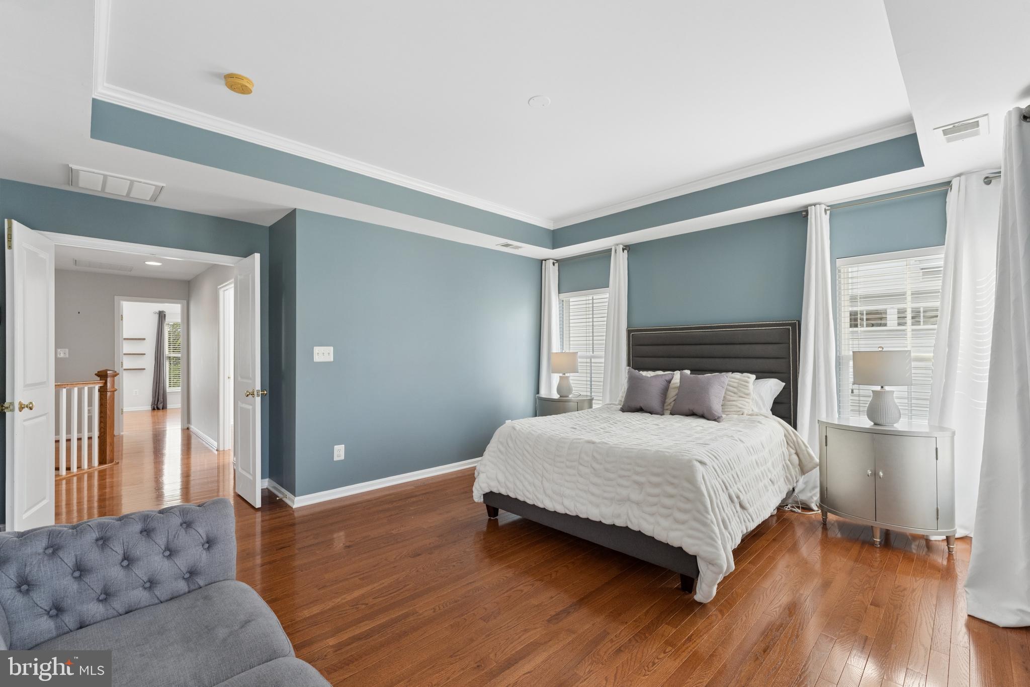 23342 Higbee Lane Brambleton, VA 20148 - Photo 36 of 73 a bedroom with a bed and a mirror