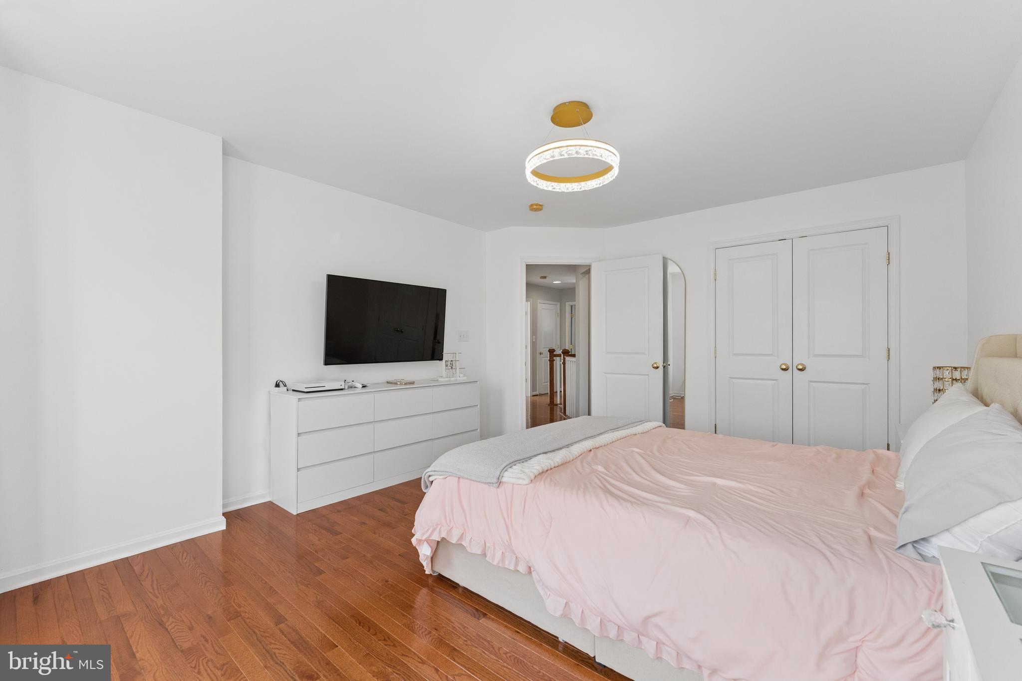 23342 Higbee Lane Brambleton, VA 20148 - Photo 45 of 73 a bedroom with a bed and a flat screen tv