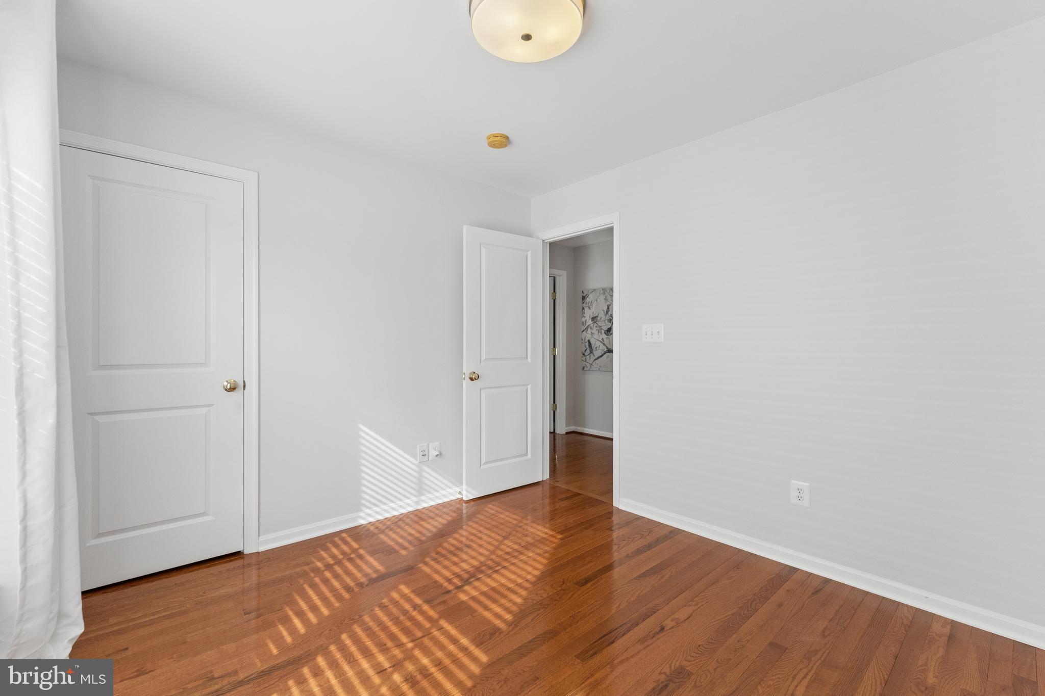 23342 Higbee Lane Brambleton, VA 20148 - Photo 47 of 73 a view of an empty room with wooden floor