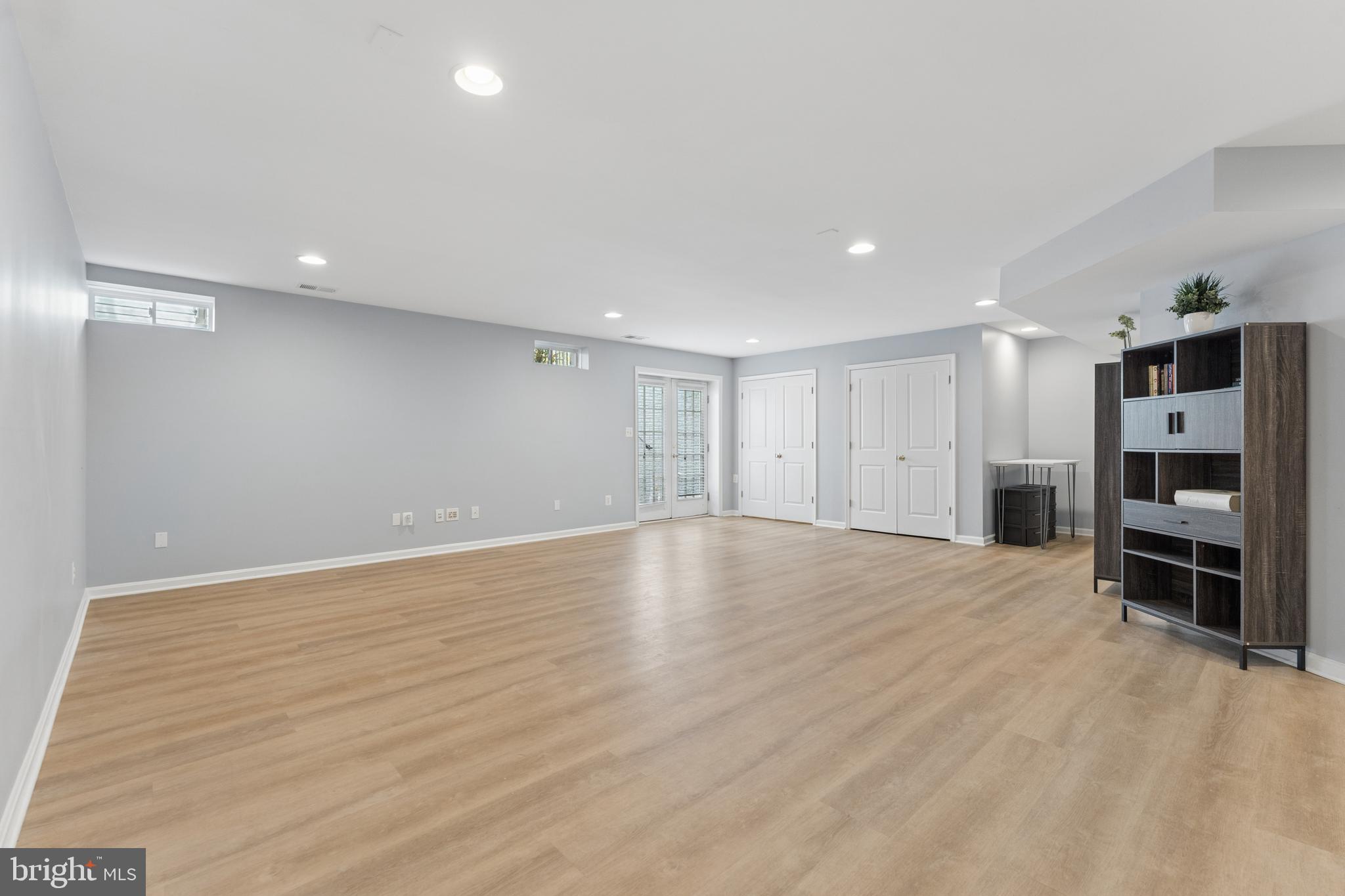 23342 Higbee Lane Brambleton, VA 20148 - Photo 54 of 73 Finished walk up lower level with LVP