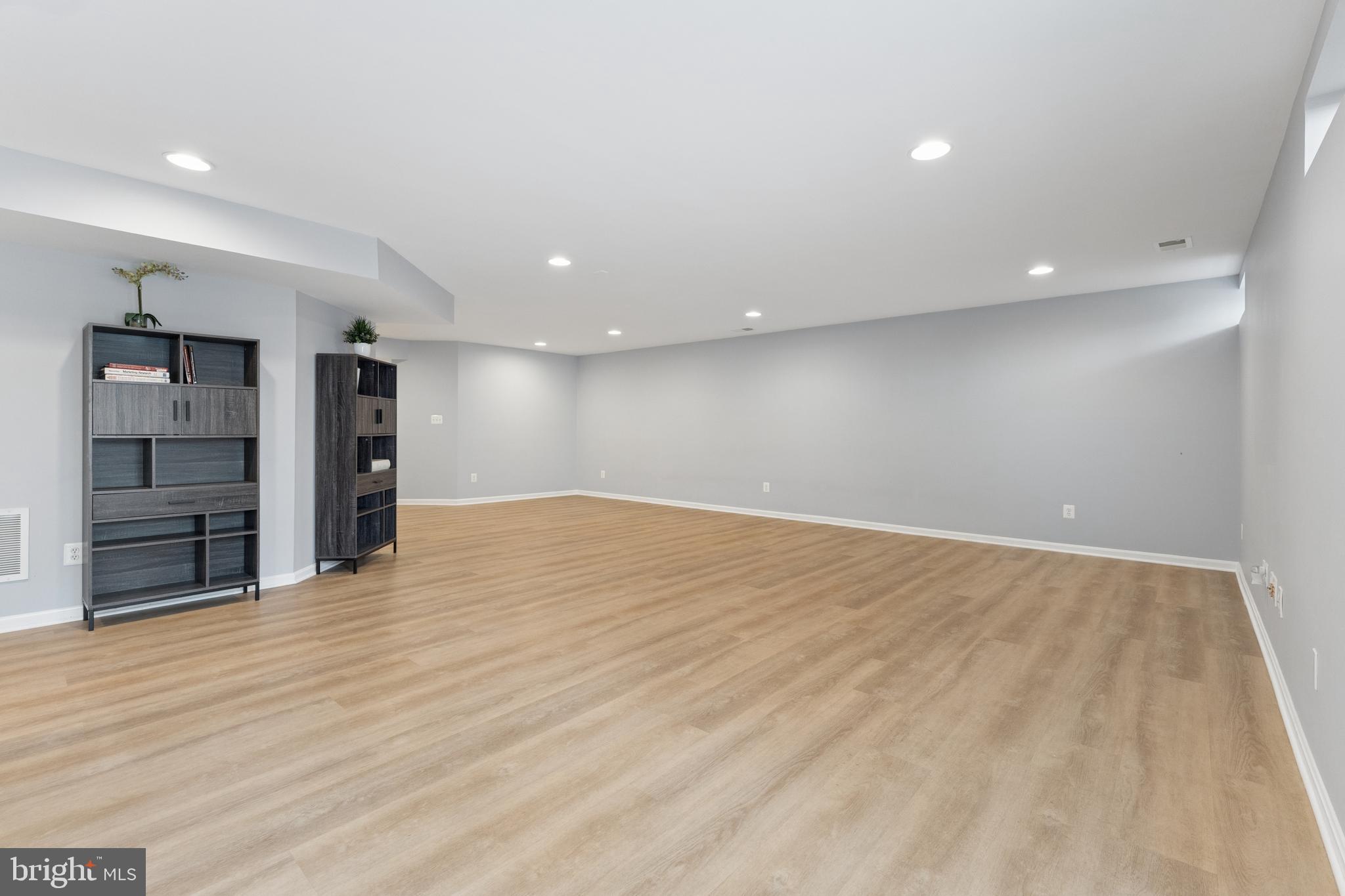 23342 Higbee Lane Brambleton, VA 20148 - Photo 56 of 73 Finished walk up lower level with LVP