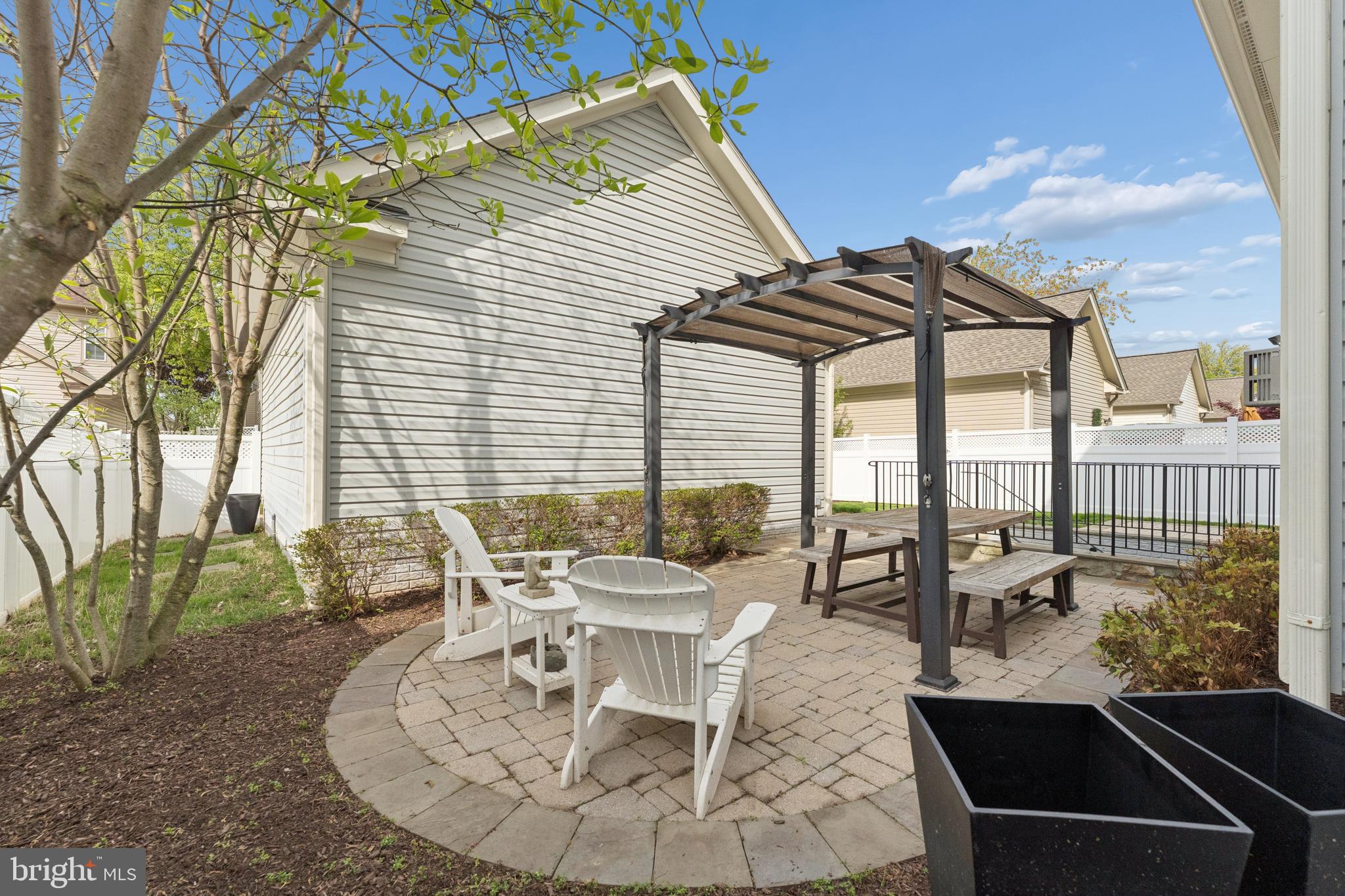 23342 Higbee Lane Brambleton, VA 20148 - Photo 67 of 73 Paver patio and pergola