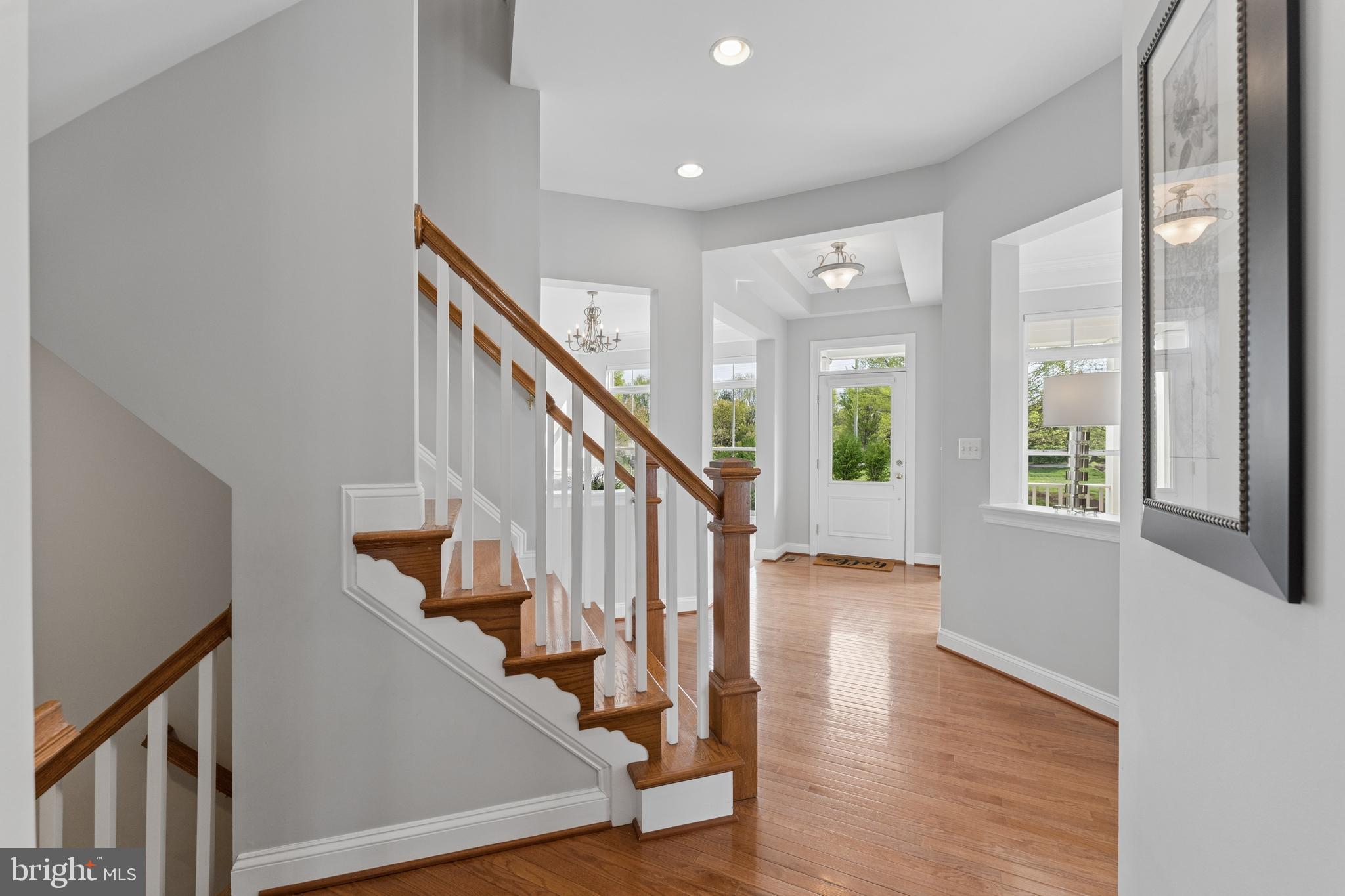 23342 Higbee Lane Brambleton, VA 20148 - Photo 8 of 73 a view of an entryway with wooden floor and stairs
