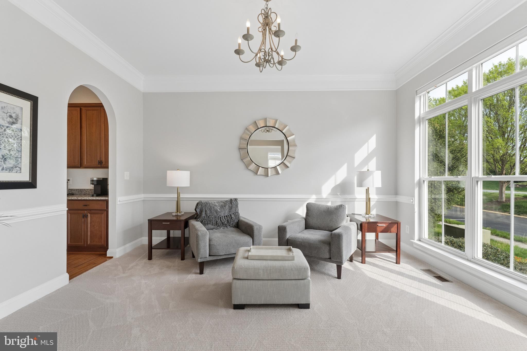 23342 Higbee Lane Brambleton, VA 20148 - Photo 9 of 73 a living room with furniture and a large window