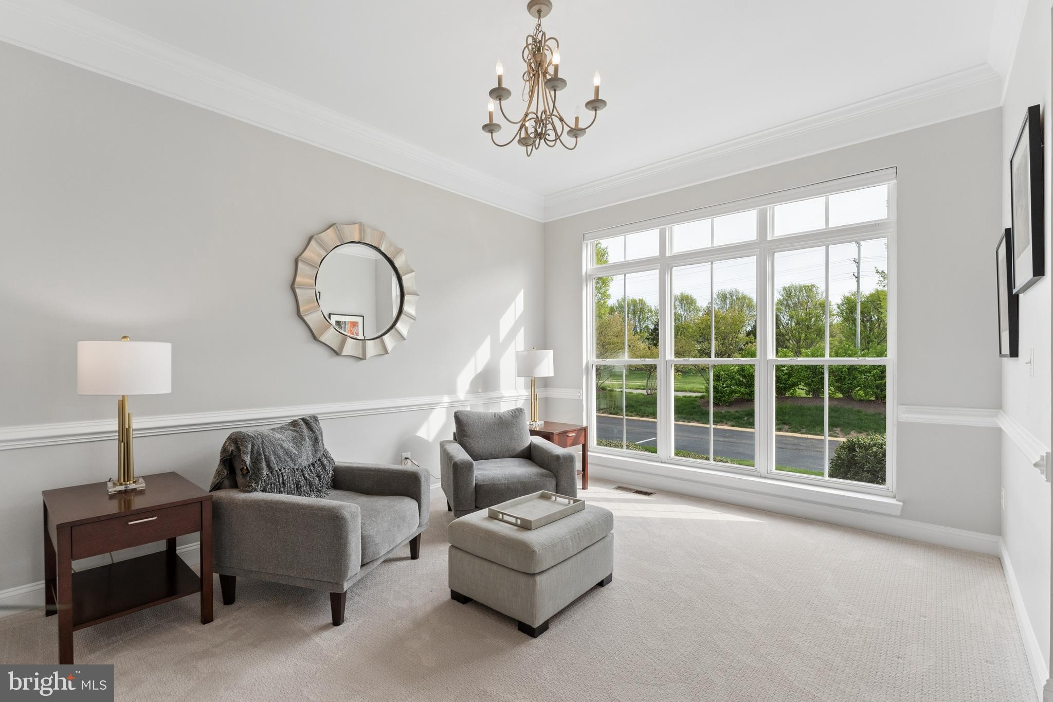 23342 Higbee Lane Brambleton, VA 20148 - Photo 10 of 73 a living room with furniture and a large window
