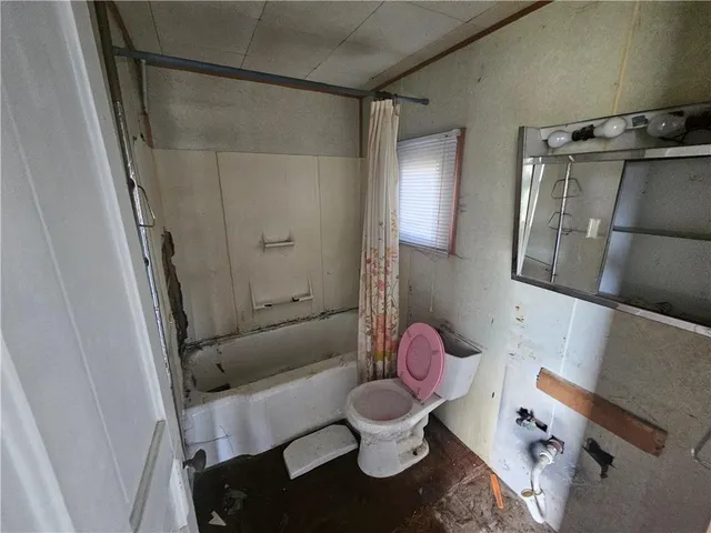 a bathroom with a sink and toilet