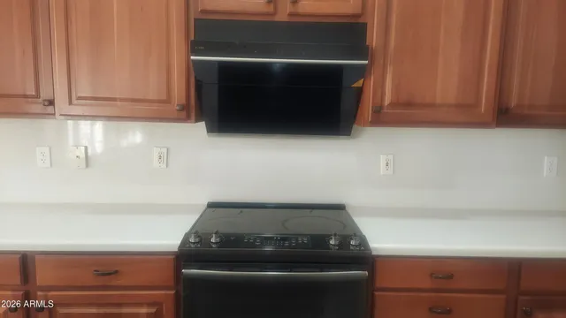 a close up of a stove top oven sitting inside of a kitchen