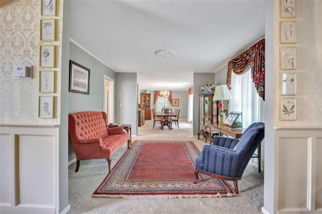 103 Gabriel Way Social Circle, GA 30025 - Photo 12 of 70 a living room with furniture and a rug