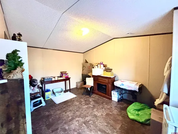 a view of a chairs and table in a room