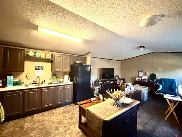 a room with furniture and a flat screen tv