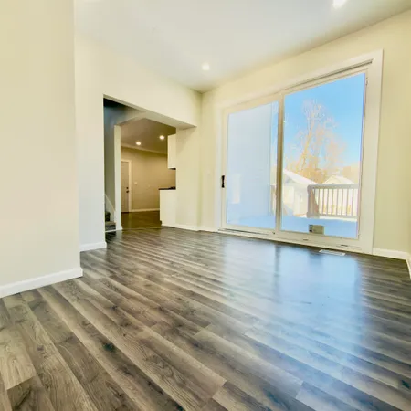 a view of a porch with wooden floor